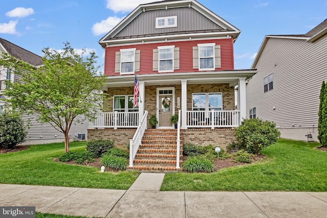 view of front of home featuring board and batten siding, a porch, and a front lawn