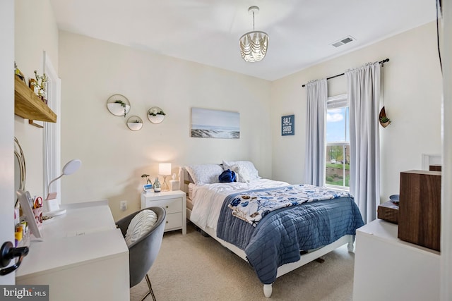 bedroom featuring light colored carpet