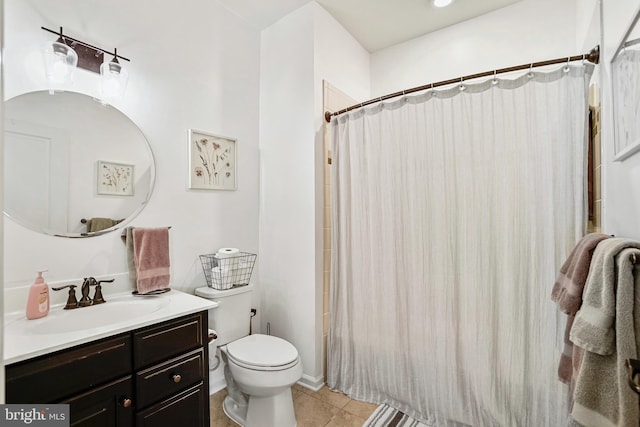 bathroom featuring tile patterned floors, toilet, vanity, and a shower with curtain
