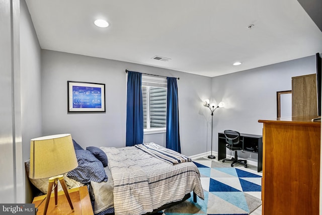 bedroom with an office area, recessed lighting, and baseboards