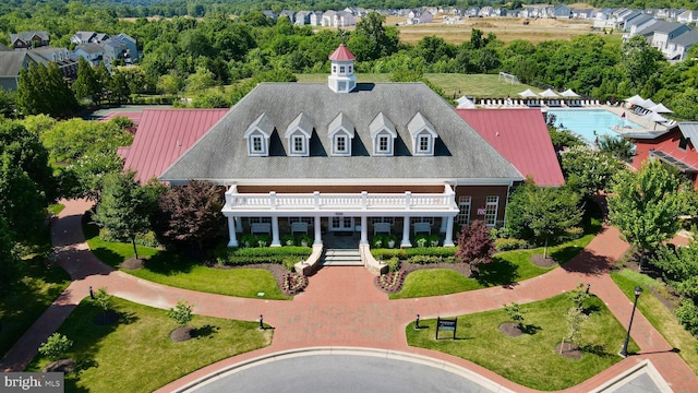 aerial view of property and surrounding area with a pool
