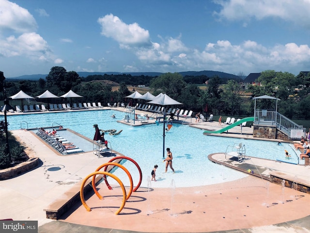 community pool with a water slide
