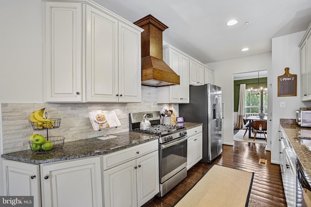 kitchen with appliances with stainless steel finishes, white cabinets, custom range hood, backsplash, and recessed lighting