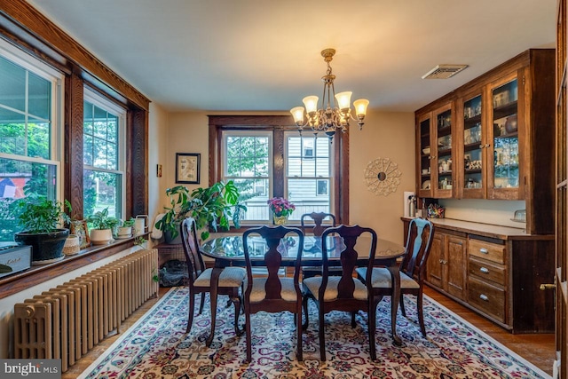466 E Main St, Leola, PA 17540 - dining room featuring radiator, a chandelier, plenty of natural light, and wood finished floors