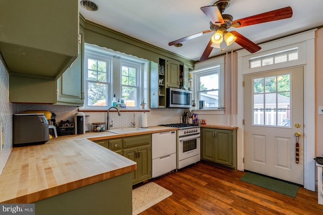 466 E Main St, Leola, PA 17540 - kitchen featuring green cabinets, a sink, stainless steel microwave, dishwasher, and gas range