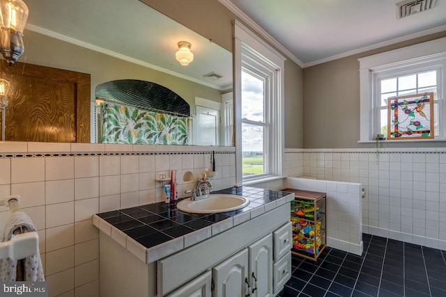 466 E Main St, Leola, PA 17540 - bathroom featuring tile walls, tile patterned flooring, crown molding, vanity, and a wainscoted wall