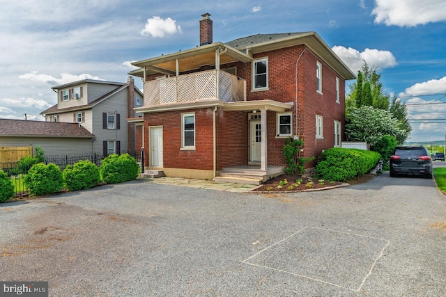 466 E Main St, Leola, PA 17540 - back of house with a balcony, brick siding, a chimney, and fence