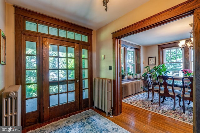 466 E Main St, Leola, PA 17540 - entrance foyer with radiator, wood finished floors, and a chandelier