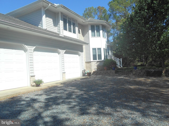 4906 Timbermarsh Ln, Woolford, MD 21677 - view of property exterior featuring a garage and driveway
