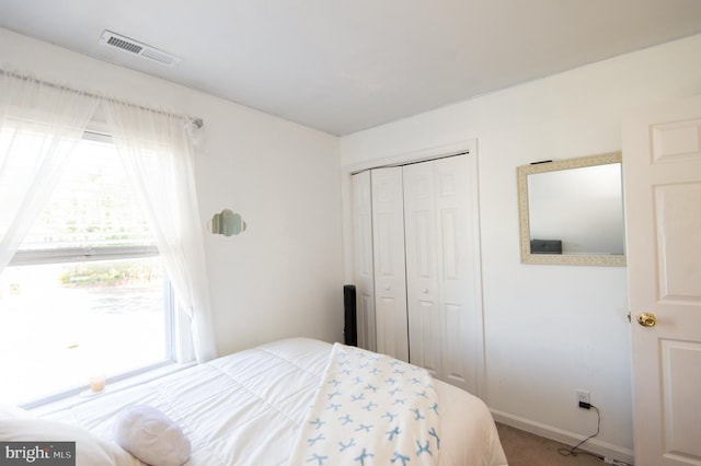 4906 Timbermarsh Ln, Woolford, MD 21677 - bedroom featuring a closet, baseboards, and carpet flooring