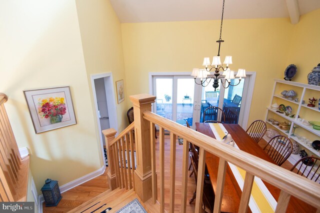 4906 Timbermarsh Ln, Woolford, MD 21677 - staircase with a chandelier, wood finished floors, baseboards, and a high ceiling