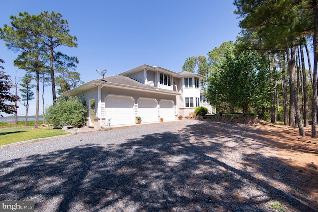 4906 Timbermarsh Ln, Woolford, MD 21677 - view of front facade featuring gravel driveway and a garage