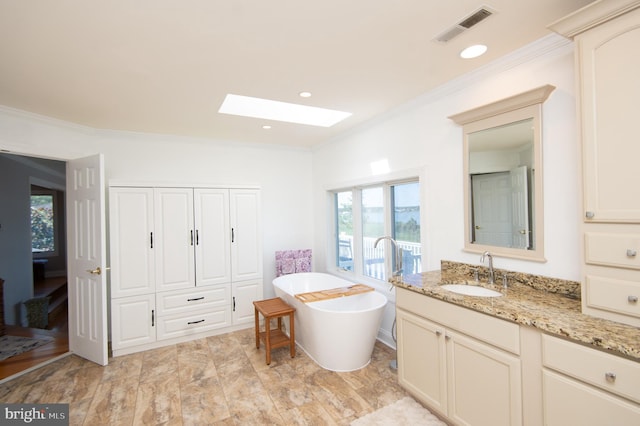 4906 Timbermarsh Ln, Woolford, MD 21677 - bathroom with a skylight, crown molding, a soaking tub, and vanity