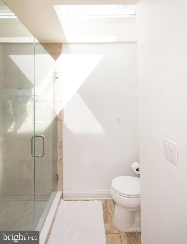 4906 Timbermarsh Ln, Woolford, MD 21677 - full bath featuring a stall shower, toilet, tile patterned floors, and baseboards