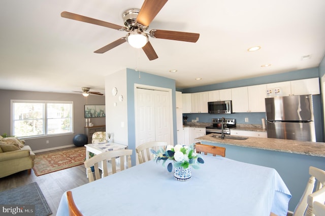 4906 Timbermarsh Ln, Woolford, MD 21677 - dining room with wood finished floors, a ceiling fan, baseboards, and recessed lighting