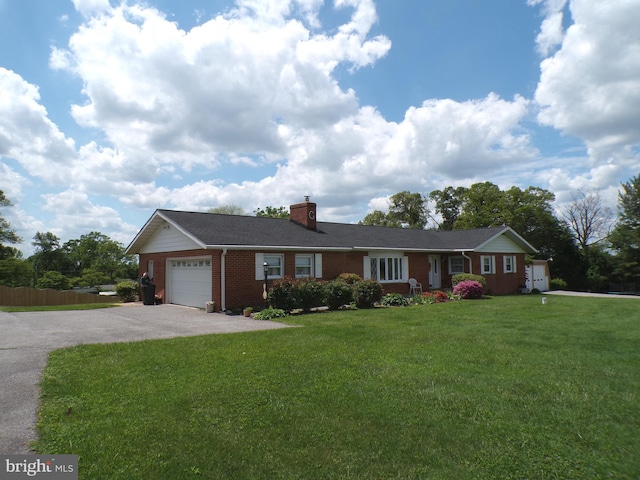 2713 Rowe Rd, New Windsor, MD 21776 - single story home with asphalt driveway, a garage, a chimney, a front yard, and brick siding