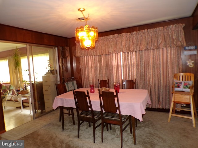 2713 Rowe Rd, New Windsor, MD 21776 - carpeted dining space with a chandelier and wood walls