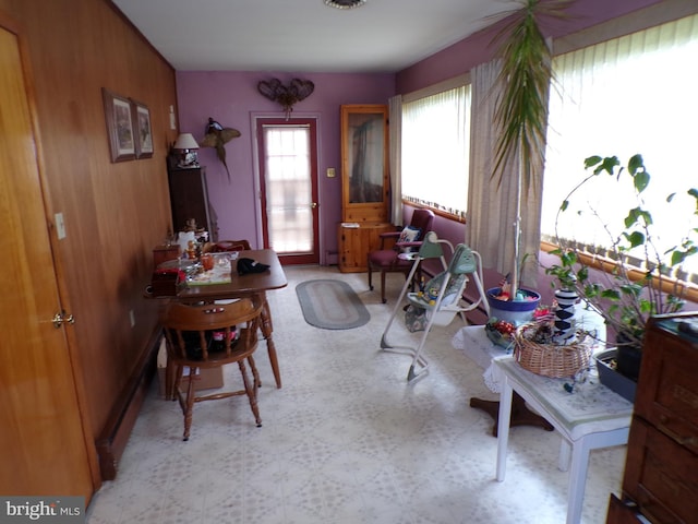2713 Rowe Rd, New Windsor, MD 21776 - dining space with tile patterned floors, healthy amount of natural light, and wood walls