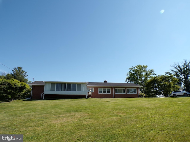 2713 Rowe Rd, New Windsor, MD 21776 - view of front of home featuring brick siding, a front yard, and a chimney