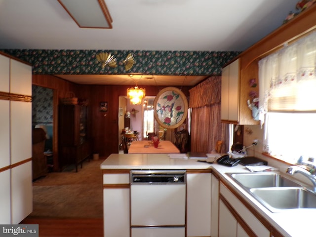 2713 Rowe Rd, New Windsor, MD 21776 - kitchen featuring dishwasher, a peninsula, a sink, light countertops, and white cabinetry