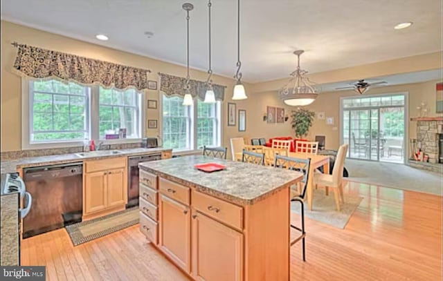 554 Pinecrest Dr, Pocono Pines, PA 18350 - kitchen with dishwasher, healthy amount of natural light, light wood-type flooring, a breakfast bar area, and recessed lighting