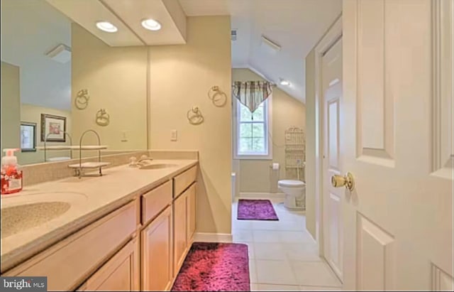 554 Pinecrest Dr, Pocono Pines, PA 18350 - full bathroom featuring vaulted ceiling, toilet, tile patterned flooring, and double vanity