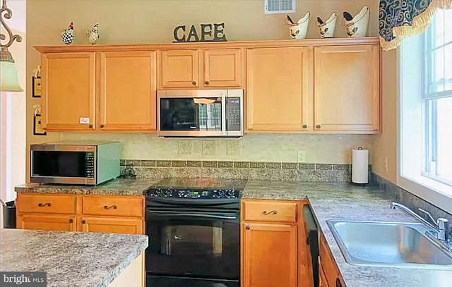 554 Pinecrest Dr, Pocono Pines, PA 18350 - kitchen featuring stainless steel microwave, stove, a sink, and dishwasher