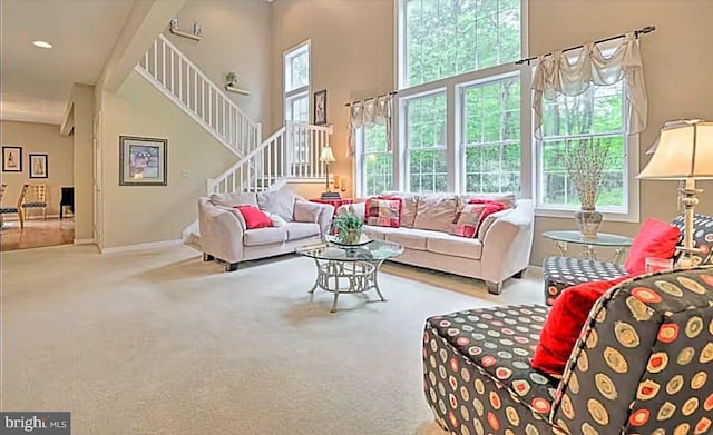 554 Pinecrest Dr, Pocono Pines, PA 18350 - living area with stairs, carpet, and baseboards