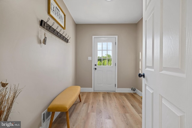 entryway with light wood-style floors and baseboards