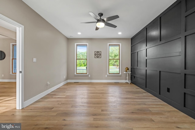 unfurnished room with ceiling fan, baseboards, light wood-style flooring, and recessed lighting