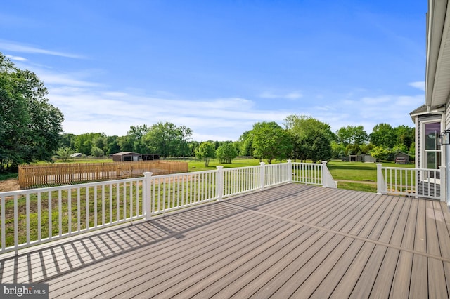 wooden terrace featuring view of scattered trees