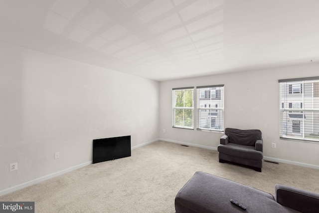 sitting room with carpet floors and baseboards