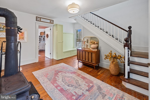 3947 Hebron Valley Rd, Madison, VA 22727 - entrance foyer with stairway, hardwood / wood-style flooring, and a wood stove