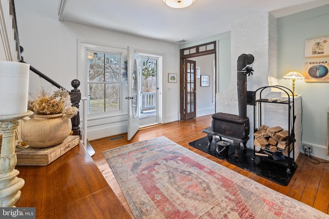 3947 Hebron Valley Rd, Madison, VA 22727 - living area with a wood stove, wood finished floors, and baseboards