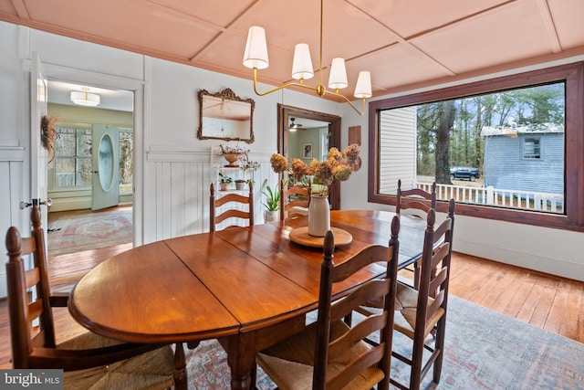 3947 Hebron Valley Rd, Madison, VA 22727 - dining space with hardwood / wood-style floors, a chandelier, and wainscoting
