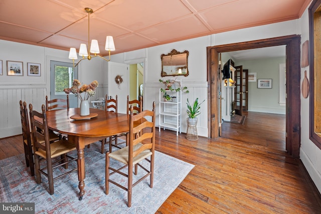 3947 Hebron Valley Rd, Madison, VA 22727 - dining area with hardwood / wood-style floors, a decorative wall, a chandelier, and wainscoting