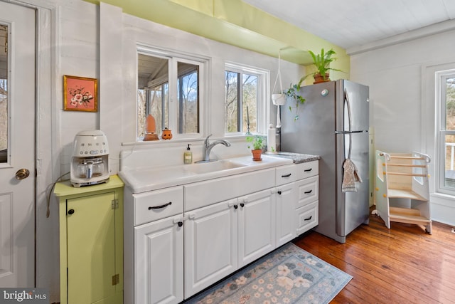 3947 Hebron Valley Rd, Madison, VA 22727 - kitchen with freestanding refrigerator, plenty of natural light, white cabinets, and light wood finished floors
