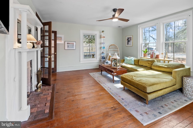3947 Hebron Valley Rd, Madison, VA 22727 - living area with hardwood / wood-style flooring, plenty of natural light, a fireplace, and ceiling fan