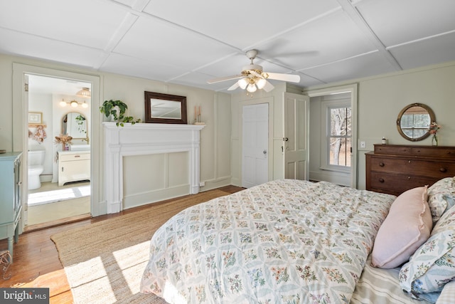 3947 Hebron Valley Rd, Madison, VA 22727 - bedroom featuring wood finished floors, connected bathroom, and a ceiling fan