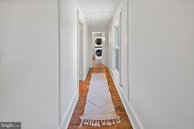 3947 Hebron Valley Rd, Madison, VA 22727 - hallway with stacked washer / drying machine, wood finished floors, and baseboards