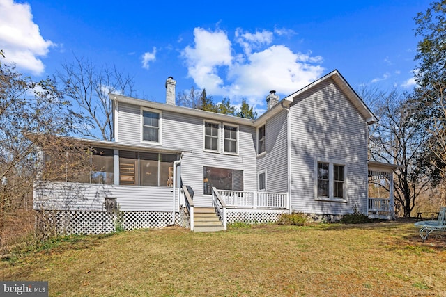 3947 Hebron Valley Rd, Madison, VA 22727 - rear view of property featuring a sunroom, a chimney, a trampoline, a deck, and a lawn