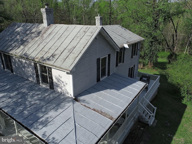 3947 Hebron Valley Rd, Madison, VA 22727 - view of property exterior featuring a chimney, a wooden deck, and a wooded view