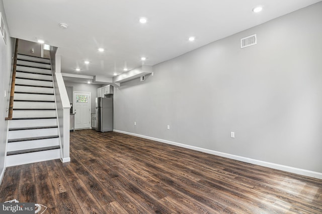 3109 W Arizona St, Philadelphia, PA 19132 - basement with freestanding refrigerator, dark wood-type flooring, recessed lighting, baseboards, and stairway