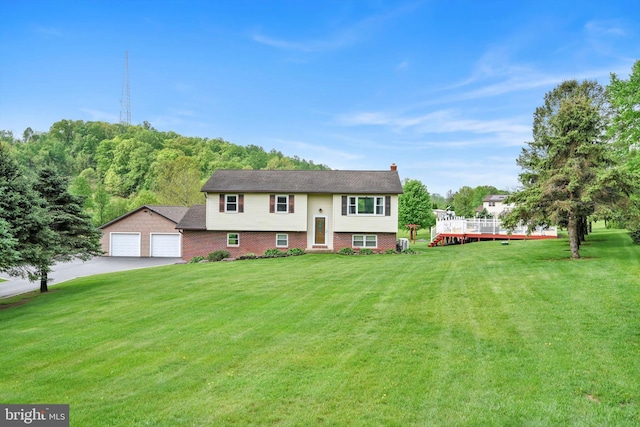191 Meadow Dr, Mohrsville, PA 19541 - split foyer home with a front yard, driveway, and a chimney