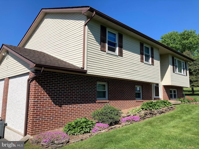 191 Meadow Dr, Mohrsville, PA 19541 - view of side of property with brick siding and a yard