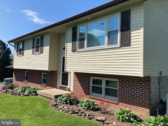 191 Meadow Dr, Mohrsville, PA 19541 - rear view of house with a yard