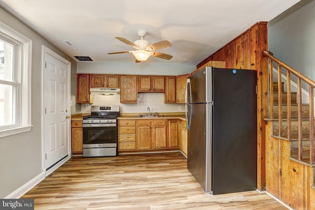 1334 Dalton Rd, Baltimore, MD 21234 - kitchen with stainless steel appliances, under cabinet range hood, a sink, ceiling fan, and healthy amount of natural light