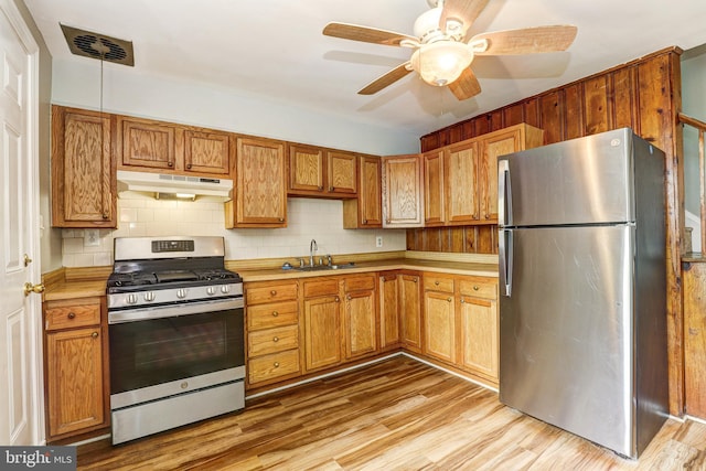 1334 Dalton Rd, Baltimore, MD 21234 - kitchen featuring appliances with stainless steel finishes, under cabinet range hood, a sink, and light countertops