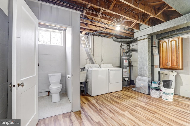 1334 Dalton Rd, Baltimore, MD 21234 - below grade area with water heater, separate washer and dryer, concrete block wall, and heating unit
