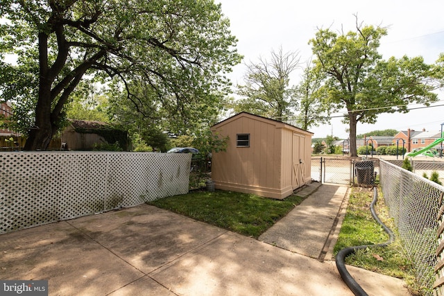 1334 Dalton Rd, Baltimore, MD 21234 - view of patio featuring a fenced backyard, a storage shed, and an outbuilding